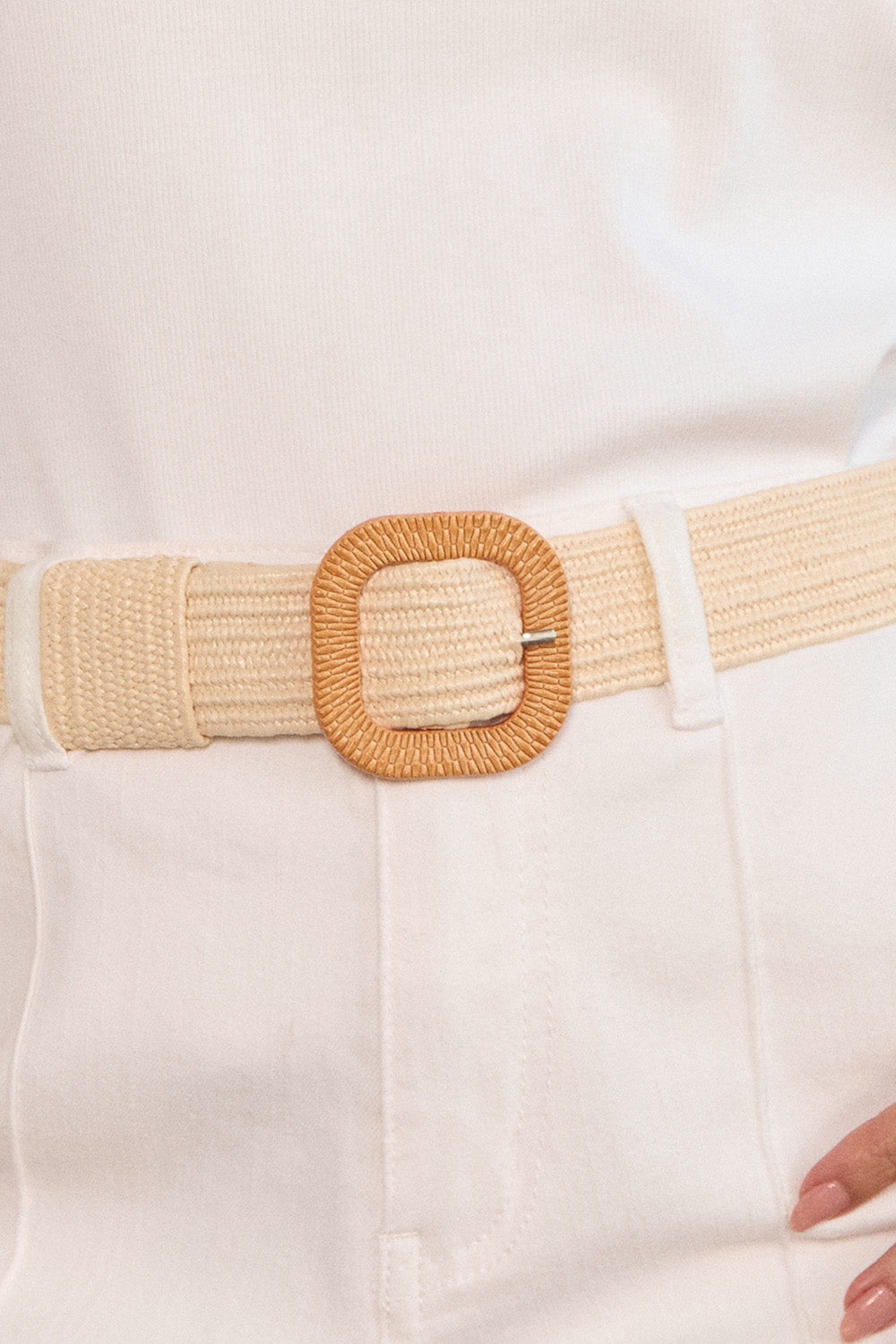 Beige woven belt with a square buckle on a white background