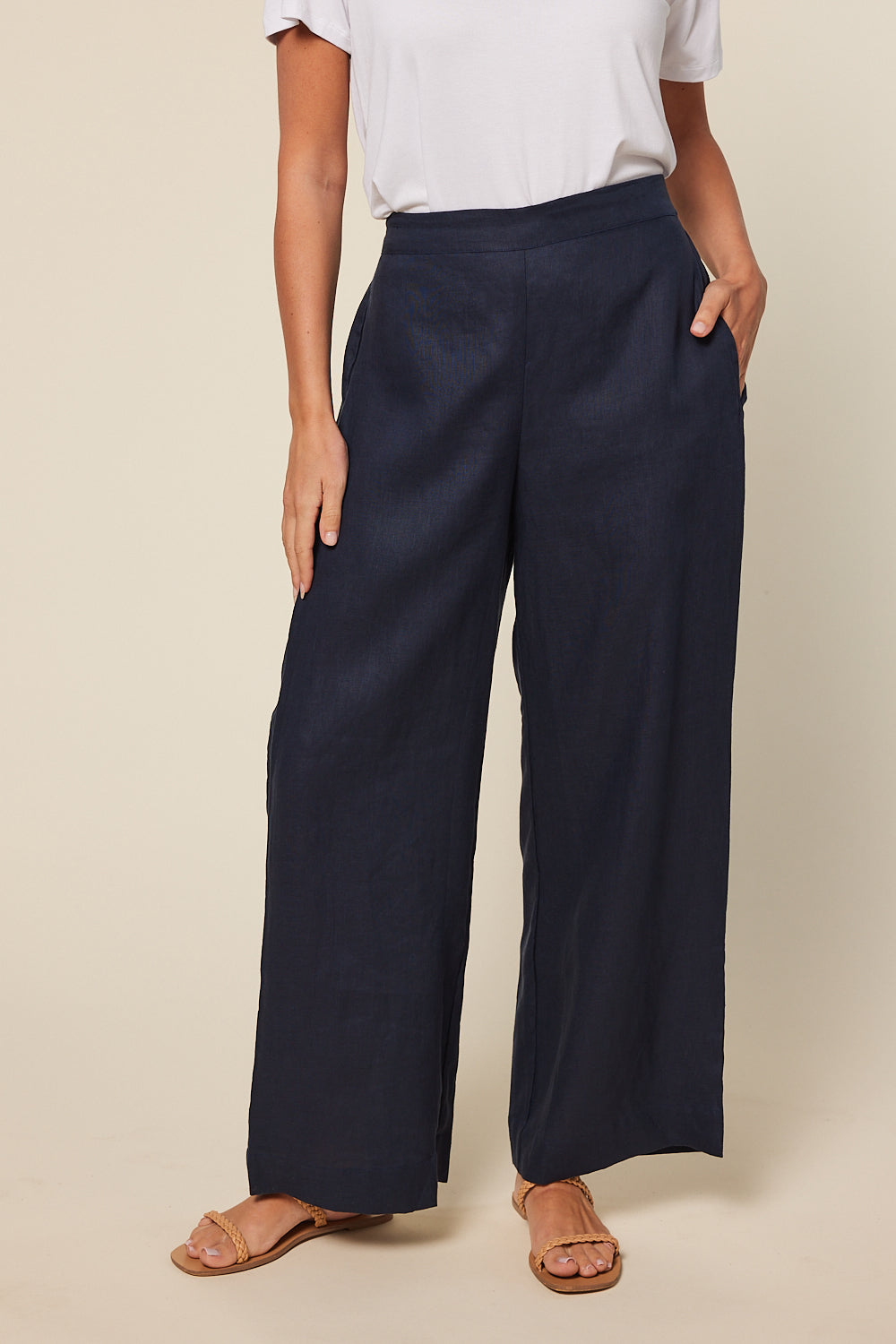 Model wearing the Camille Linen Wide Leg Pant in Navy with high-waisted fit, Adrift Clothing