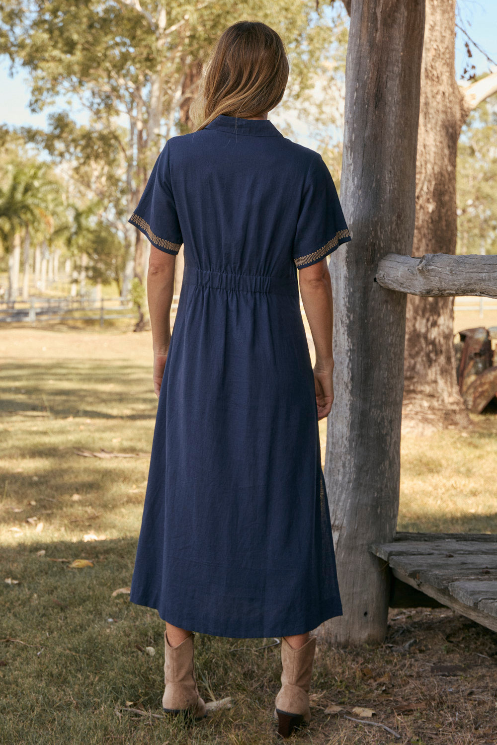 Model wearing the Gracie Shirt Dress in Midnight Clay with contrast embroidery and side splits, Adrift Clothing