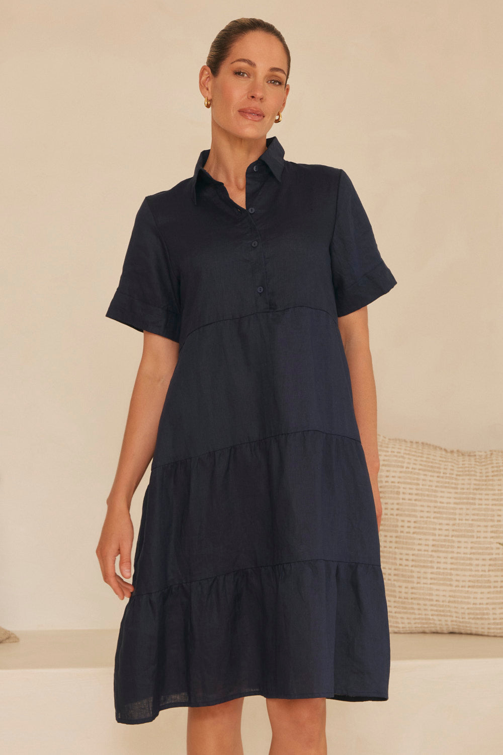 Model wearing the Winslow Linen Knee-Length Dress in Navy with relaxed short sleeves, Adrift Clothing