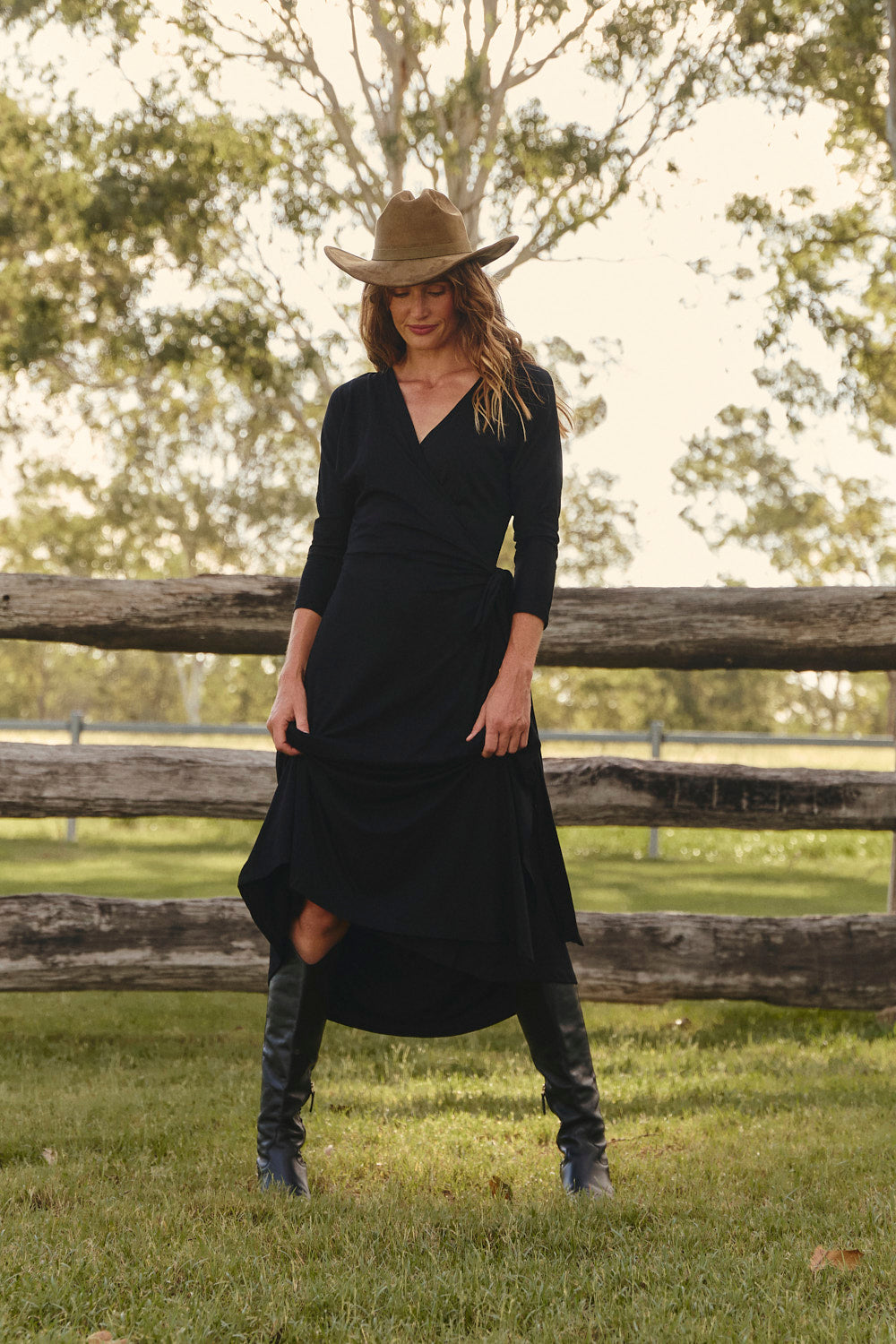Wrap Stretch Dress in Black holding a sleek flattering shape, Adrift Clothing