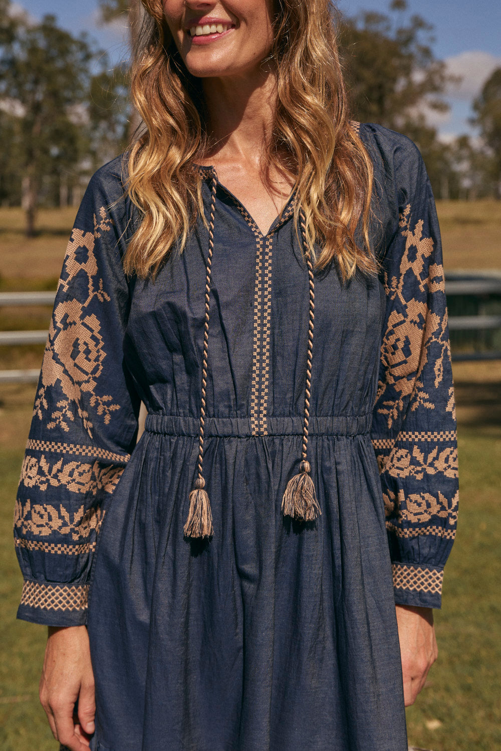 Tabitha Embroidered Chambray Dress in Mid Wash featuring elasticated waist and pockets, Australian womenswear by Adrift